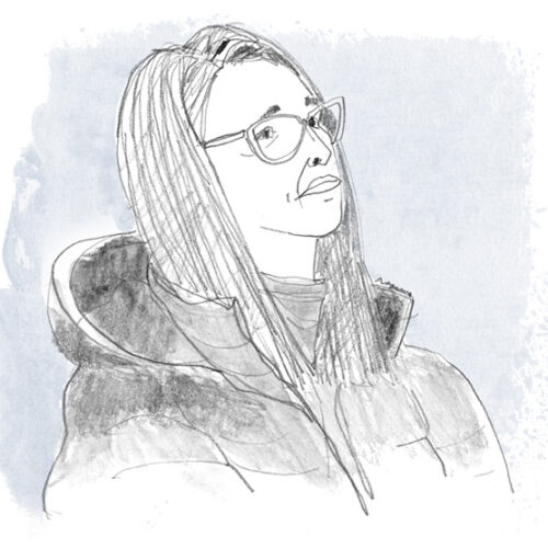 Woman-wearing-parka-blue-background Woman-wearing-parka-blue-background